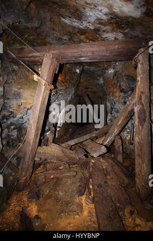 CALLINGTON, CORNWALL, UK: EERIE images reveal the Cornish mining tunnel that was once used to test explosives and research the potential impact of nuclear tests during the Cold War under the code name Operation Orpheus. The haunting pictures show inside the 2,180-foot tunnel where rusting sleepers and collapsing structures remain. Other shots, look down into an adit (entrance) and show the unsuspecting exterior of the mine where a metal gate has been closed across. The spectacular images were taken at the Excelsior Tunnel, Kit Hill, Callington, Cornwall by editor, Nat W (46) from London. To ta Stock Photo