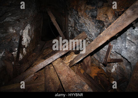 CALLINGTON, CORNWALL, UK: EERIE images reveal the Cornish mining tunnel that was once used to test explosives and research the potential impact of nuclear tests during the Cold War under the code name Operation Orpheus. The haunting pictures show inside the 2,180-foot tunnel where rusting sleepers and collapsing structures remain. Other shots, look down into an adit (entrance) and show the unsuspecting exterior of the mine where a metal gate has been closed across. The spectacular images were taken at the Excelsior Tunnel, Kit Hill, Callington, Cornwall by editor, Nat W (46) from London. To ta Stock Photo