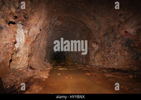 CALLINGTON, CORNWALL, UK: EERIE images reveal the Cornish mining tunnel that was once used to test explosives and research the potential impact of nuclear tests during the Cold War under the code name Operation Orpheus. The haunting pictures show inside the 2,180-foot tunnel where rusting sleepers and collapsing structures remain. Other shots, look down into an adit (entrance) and show the unsuspecting exterior of the mine where a metal gate has been closed across. The spectacular images were taken at the Excelsior Tunnel, Kit Hill, Callington, Cornwall by editor, Nat W (46) from London. To ta Stock Photo