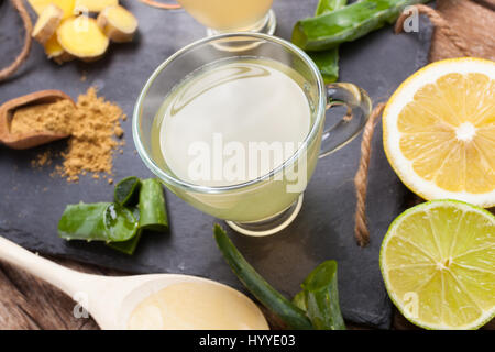 Drink with aloe vera and lemons. Glass cups on a slate tray. Stock Photo