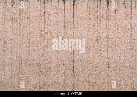 Spannish exterior rough wall paint ruined by water stains Stock Photo