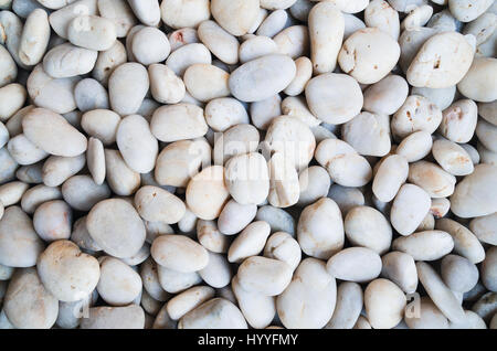 Many small natural white stones texture Stock Photo