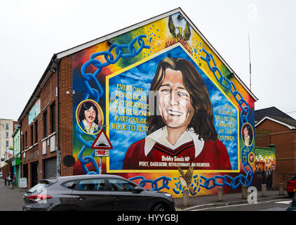 Wall mural depicting Bobby Sands, on the side of the Sinn Féin office, Falls Road, Belfast, County Antrim, Northern Ireland, UK Stock Photo