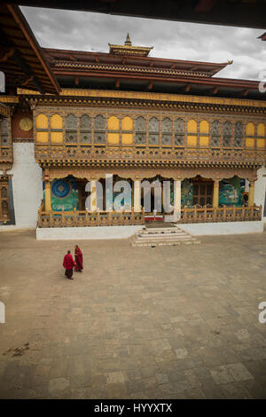 Two monks meeting in the second courtyard in Punakha Dzong (Bhutan) Stock Photo