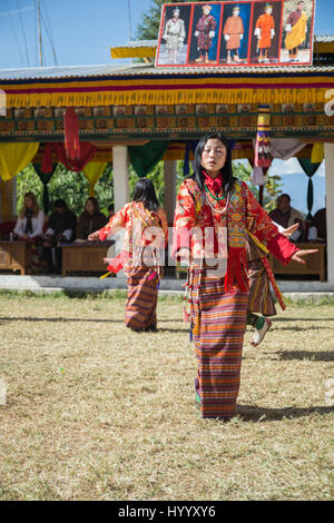 Dancing Women at tsechu in the eastern town of Shongpu (Bhutan) Stock Photo