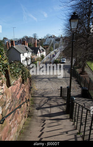 City of Chester, England. Picturesque view of steps leading to the Queens Park Suspension Bridge over the River Dee. Stock Photo