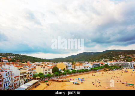 Tossa de Mar, Spain - August 4, 2010: Beach and people at Tossa de Mar on the Costa Brava at the Mediterranean Sea in Spain. Stock Photo