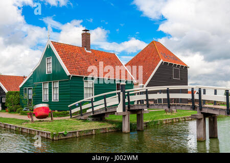 Typical wooden houses and small creek in famous village of Zaanse Schans, Netherlands. Stock Photo