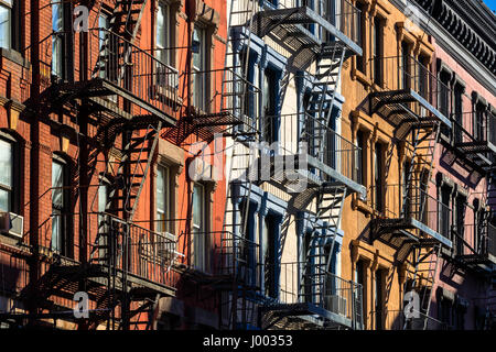 Colorful Soho building facades with painted fire escapes. Manhattan, New York City Stock Photo