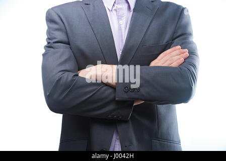 Modern man in suit with crossed arms closeup isolated on white background Stock Photo