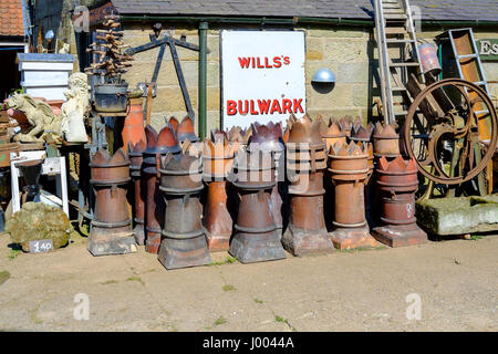 Old fashioned recovered chimney pots for sale in an Antique business in North Yorkshire as garden ornaments or planters Stock Photo