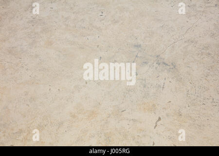Worn whitewashed wall background with small cracks Stock Photo