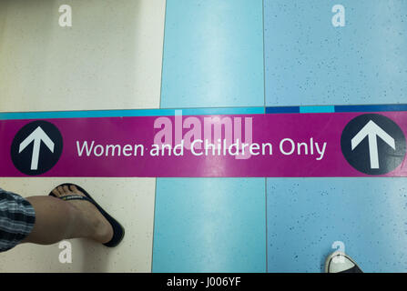 Signage, entrance to the women and children cabin,Dubai Metro