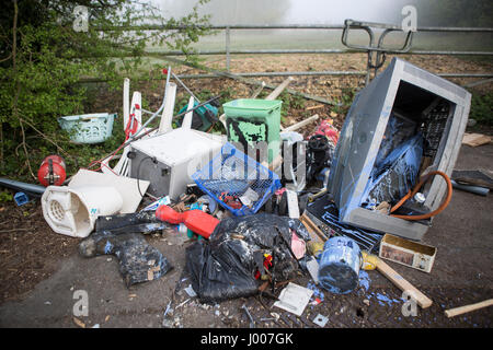 Waste dumped in the Wiltshire countryside, an illegal social issue, fly tipping causing environmental pollution Stock Photo