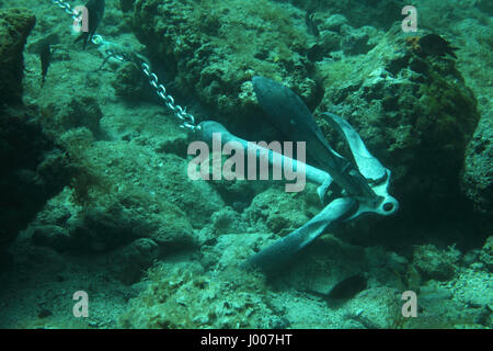 Anchor of ship underwater on the bottom of the sea Stock Photo