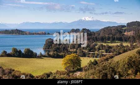Calbuco volcano rises from the shores of Lago Llanquihue lake as viewed from Puerto Octay in the Los Lagos region of Chilean Patagonia. Stock Photo