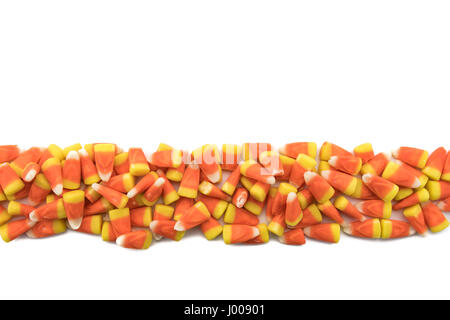 Candy Corns in Row on Isolated White Background Stock Photo