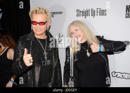 Billy Idol and Penelope Spheeris arrive for the Premiere Of 'SHOT! The Psycho-Spiritual Mantra of Rock' held at Pacific Theatres  in Los Angeles, California at The Grove on April 5, 2017. Stock Photo