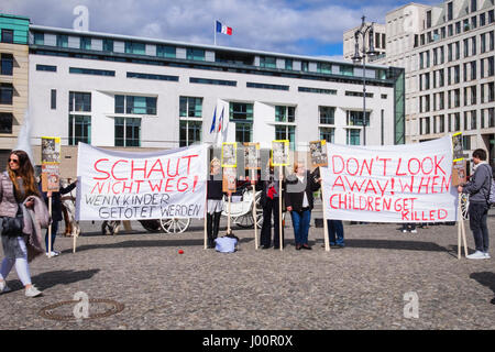 Germany,Berlin,Pariser Platz.8th April 2017 Do not look away when children are gassed. People with banners and posters protest against the use of Chemical Weapons in Syria. © Eden Breitz/Alamy Live News Stock Photo