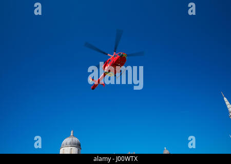 London's Air Ambulance lands at Trafalgar Square in response to a nearby accident, London England United Kingdom UK Stock Photo