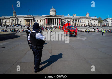 London's Air Ambulance lands at Trafalgar Square in response to a nearby accident, London England United Kingdom UK Stock Photo