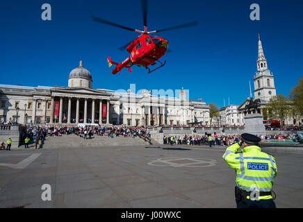 London's Air Ambulance lands at Trafalgar Square in response to a nearby accident, London England United Kingdom UK Stock Photo