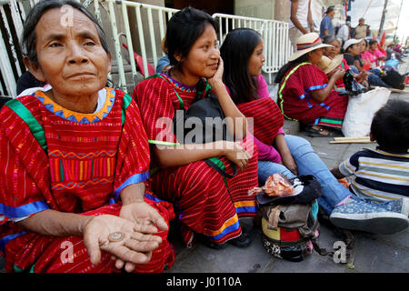 Oaxaca City, Oaxaca, Mexico. 8th Apr, 2017. Indigenous Zacatecas Indians in colorful garb sit at El Zocalo Park in Oaxaca on March 27, 2017. Credit: Sandy Huffaker/ZUMA Wire/Alamy Live News Stock Photo