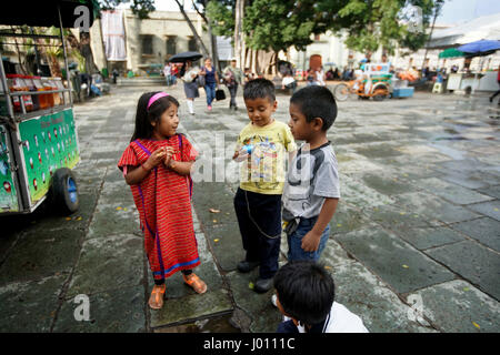 Oaxaca City, Oaxaca, Mexico. 8th Apr, 2017. Kids play in front of the main Catedral at El Zocalo Park in Oaxaca City on March 27, 2017 in Oaxaca. Credit: Sandy Huffaker/ZUMA Wire/Alamy Live News Stock Photo