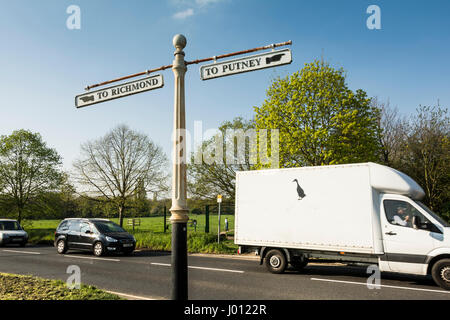 Old finger road sign to Putney and Richmond on the Lower Richmond Road, Putney Common, Putney, London, UK Stock Photo