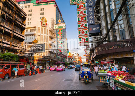 Bangkok, Thailand - April 24, 2016: Tuk-tuk taxi parked near street market in Chinatown on April 24, 2016 in Bangkok, Thailand. Stock Photo