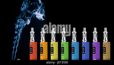 Eight multicolored electronic cigarettes and smoke - isolated on black background. Stock Photo
