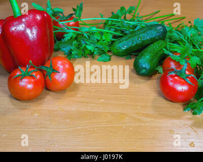 The fresh healthy vegetables and herbs on table Stock Photo