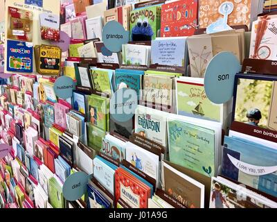 Greeting cards, birthday cards, romantic cards, get well cards, holiday cards at a grocery store card shop Stock Photo