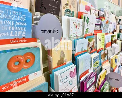 Greeting cards, birthday cards, romantic cards, get well cards, holiday cards at a grocery store card shop Stock Photo