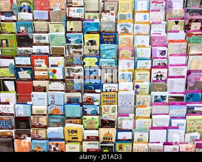 Greeting cards, birthday cards, romantic cards, get well cards, holiday cards at a grocery store card shop Stock Photo