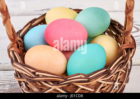 Pile of colorful Easter eggs. Close up of Easter basket. Stock Photo