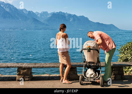 Montreux, Switzerland - August 27, 2016: Family at the embankment of Geneva Lake in Montreux, Vaud canton, Switzerland Stock Photo