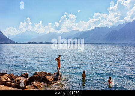 Montreux, Switzerland - August 27, 2016: People swimming in Geneva Lake in Montreux, Vaud canton, Switzerland Stock Photo