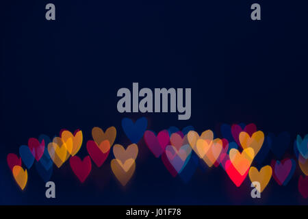 Heart shape lights line on dark blue background Stock Photo