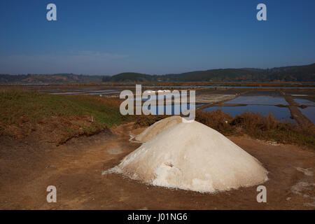 Pyramids of salt, made using traditional artisan methods in specially constructed lagoons at Cahuil on the coast of Chile. Stock Photo