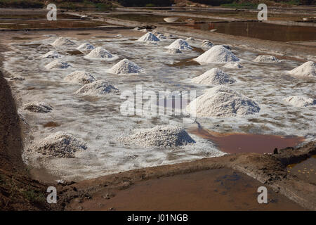 Pyramids of salt, made using traditional artisan methods in specially constructed lagoons at Cahuil on the coast of Chile. Stock Photo