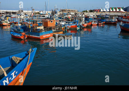 Colourful fishing boats in the harbour at Iquique on the Pacific coast of northern Chile. Stock Photo