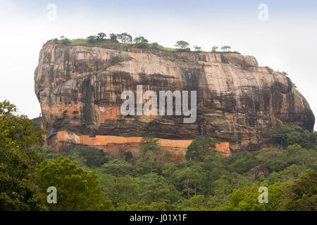 Sigiriya is a large stone and ancient rock fortress and palace ruin in the central Matale District of Sri Lanka Stock Photo