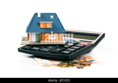 property tax and mortgage concept - house model on calculator Stock Photo