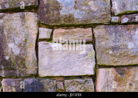 Natural Sydney sandstone cut into rectangular shapes in a retaining ...