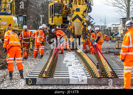 Rail construction workers installing new tracks and points Stock Photo