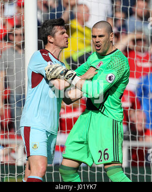 Burnley's Joey Barton (left) tussles with Middlesbrough goalkeeper Victor Valdes during the Premier League match at the Riverside Stadium, Middlesbrough. Stock Photo