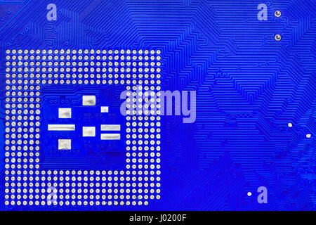 Technological background with blue computer motherboard and central ...