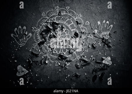 Abstract drawing on the old vintage floor with leaves and petals of flower scattered. Stock Photo