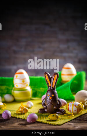 Cute chocolate bunny with Easter eggs, Easter holiday concept Stock Photo